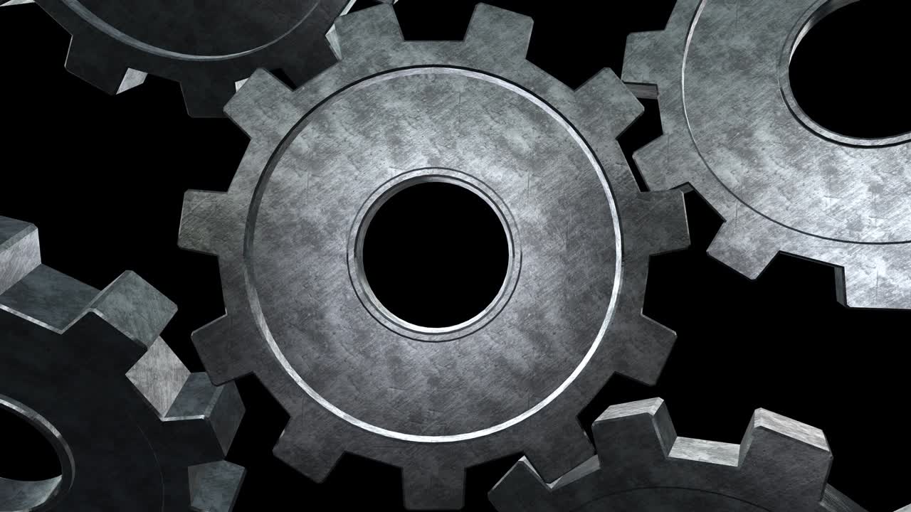cinco engranajes grises girando moscas. fondo negro. primer plano. canal alfa