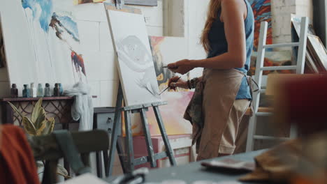 woman painting in an art studio