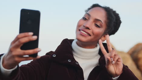 african american girl taking selfie.