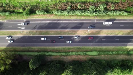 aerial top view over traffic on centennial path in manuel b gonnet, la plata city