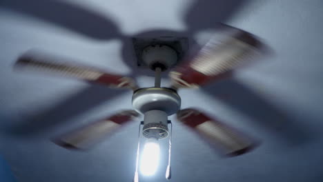 Old-Ceiling-fan-with-lit-bulb-rotating