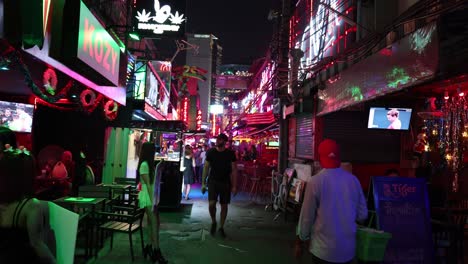 crowded street with neon lights at night