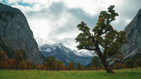 4K-UHD-time-lapse-cinemagraph-of-moving-clouds-in-Austrias-famous-alps-mountains-area-Ahornboden---Hinterriss,-close-to-the-German-border-in-Autumn-weather-with-colorful-maple-trees