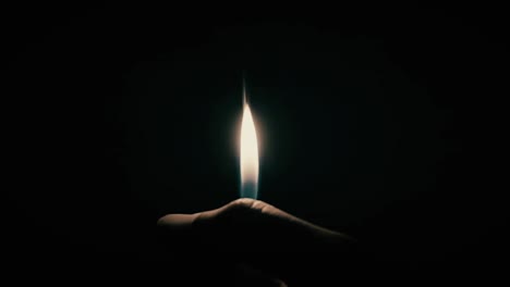 a slow motion video of a lighter in a dark room