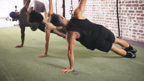 a three people working out together at the gym