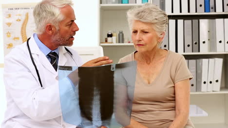 doctor explaining an xray to patient