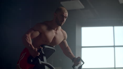 strength training of the broadest muscles of the back. bodybuilder conducts training with weights.