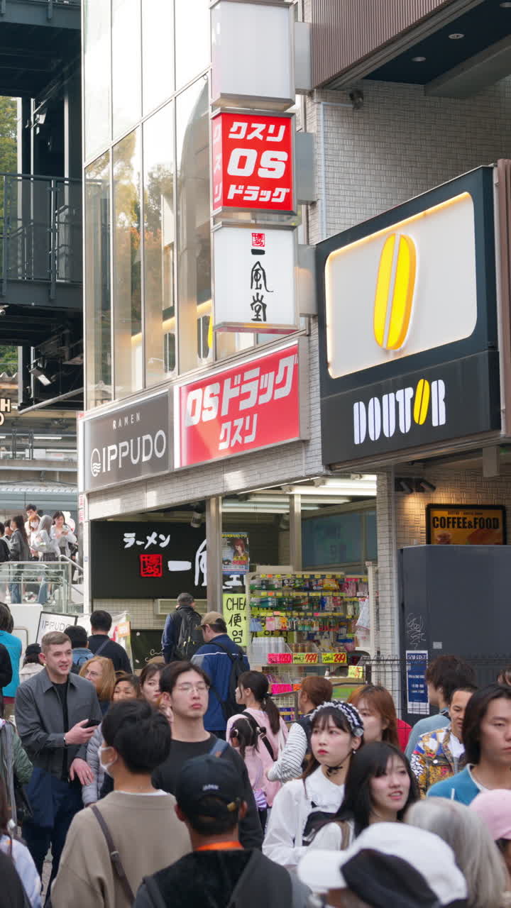 Crepes with whipped cream, different fruit and toppings on display on the Takeshita shopping street in Tokyo, Japan. Vertical