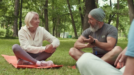senior citizens engaging in outdoor exercise and discussion
