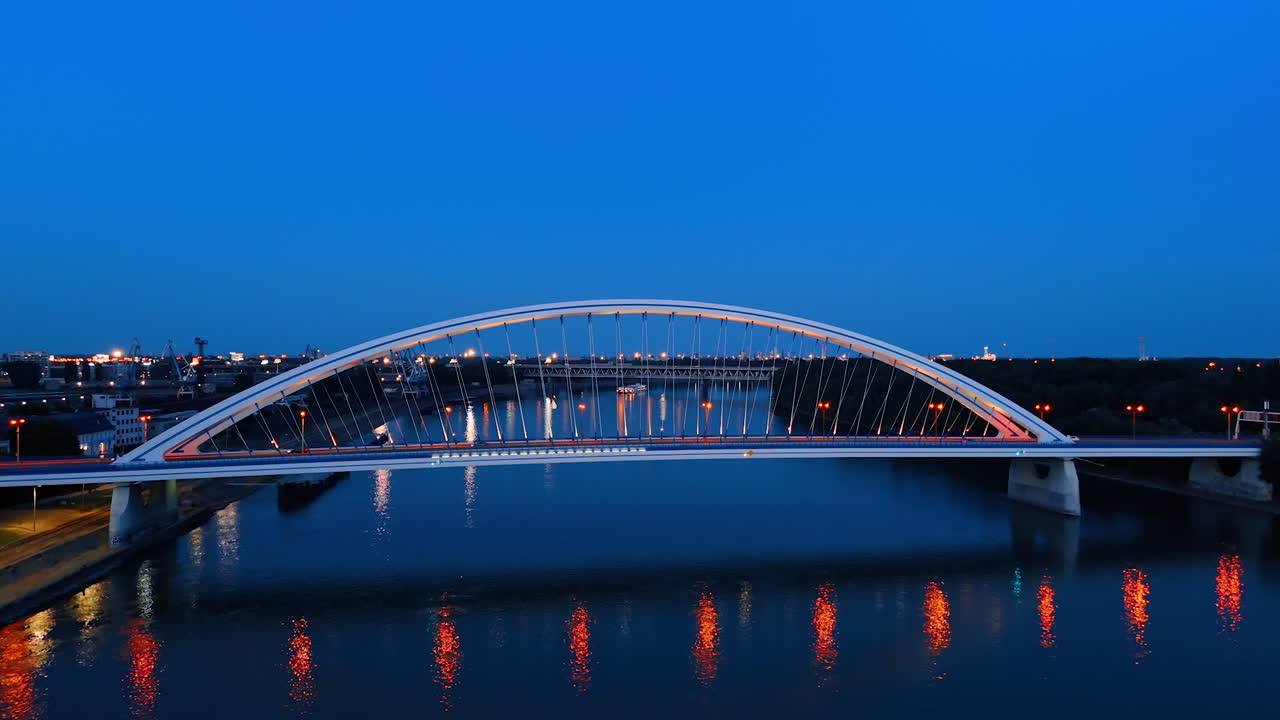 Beautiful road bridge over the Danube in the capital of Slovakia. Lights are on in the Appolo Bridge in Bratislava at dusk time