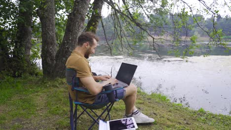 successful businessman working in nature.