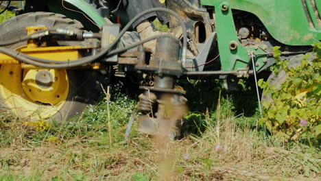 an agricultural machine uproots the weeds growing pesticide-free products organic farming