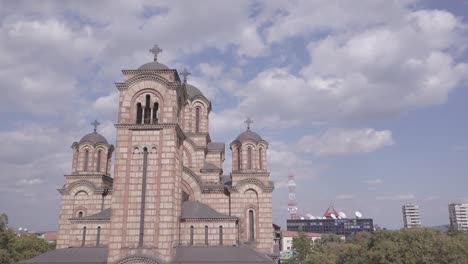 ascending revealing 4k aerial of st mark church in summer day, belgrade