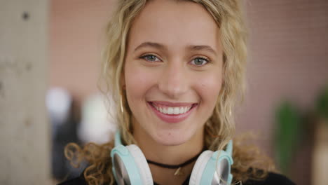 portrait of happy young woman smiling enjoying relaxed carefree lifestyle caucasian femael college student looking at camera