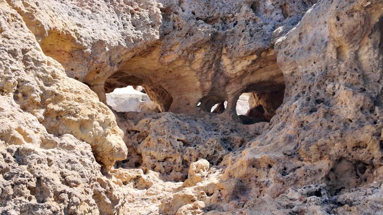 Natural arches and caves creating a mesmerizing landscape at Carvoeiro's Algar Seco, a breathtaking coastal gem in Algarve, Portugal
