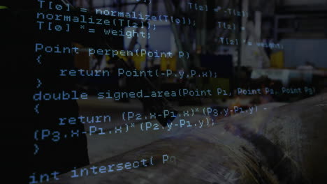 senior technician operating workbench in factory, with code overlay showing machining data