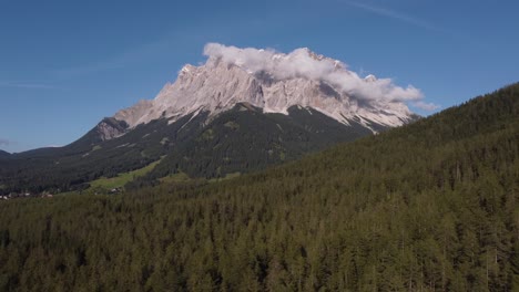 drone moving away from awesome highest mountain in germany the matterhorn on a sunny day in austria