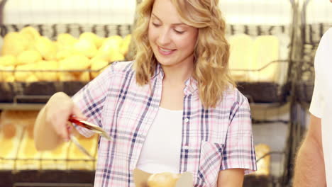 Young-happy-couple-buying-bread