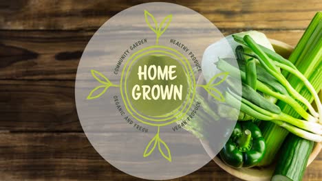 Animation-of-home-grown-vegan-produce-text-in-green,-over-bowl-of-fresh-vegetables-on-wooden-boards