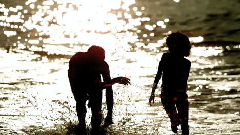 Friends-running-out-the-sea-and-splashing-around