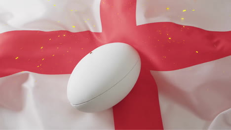 animation of confetti over white rugby ball over flag of england