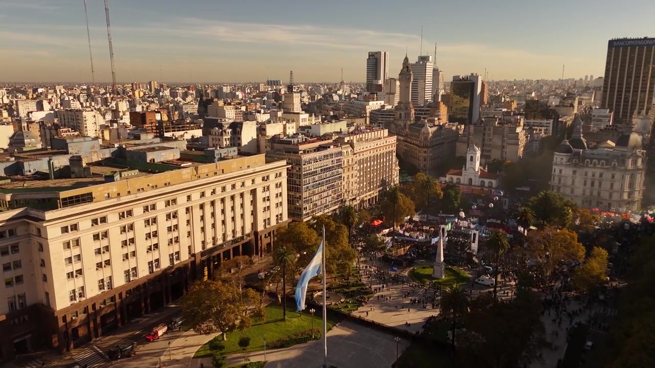 Plaza de Mayo protest with financial district skyline in background in Buenos Aires, Argentina. Aerial drone view