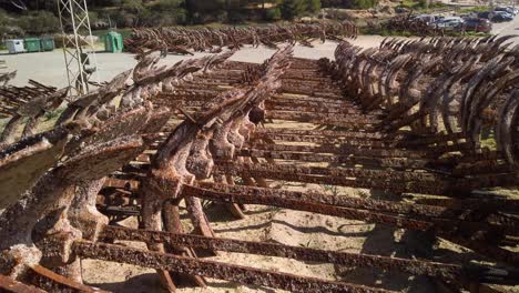 tilt down, rusty barnacled anchors stored in port at barbate, cadiz, spain