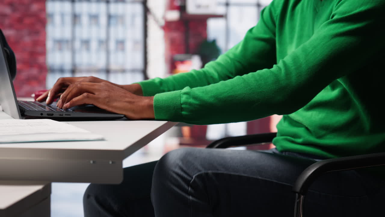 Vertical Video Black man doing remote work feeling uneasy and anxious at desk