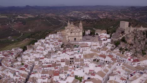 Wide-shot-of-Olvera-Spain-white-village-during-day-time,-aerial