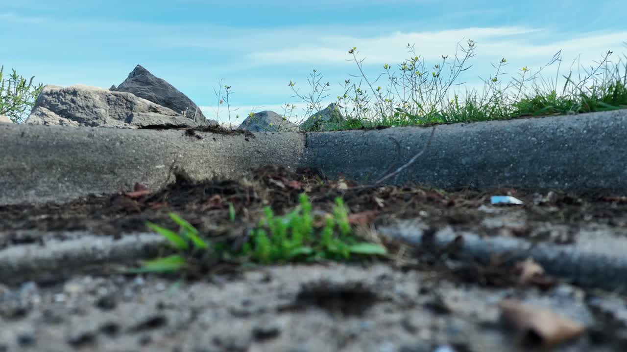 Close up look at a parking lot curb from parked drone