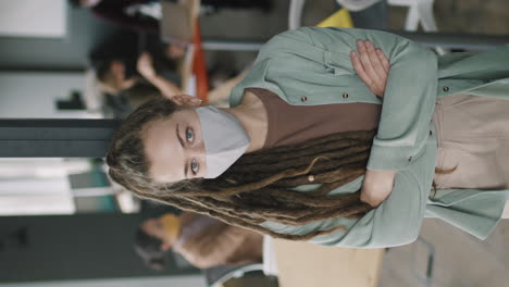 woman in office setting wearing mask