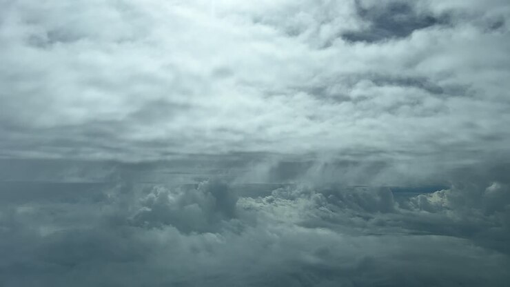 Jet cockpit point of view flying through a turbulent sky in a cold winter day with sunbeams