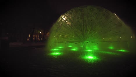 dark shot of big fountain in oslo city