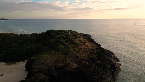 Aerial-over-Fingal-Head-at-sunrise,-Northern-New-South-Wales,-Australia