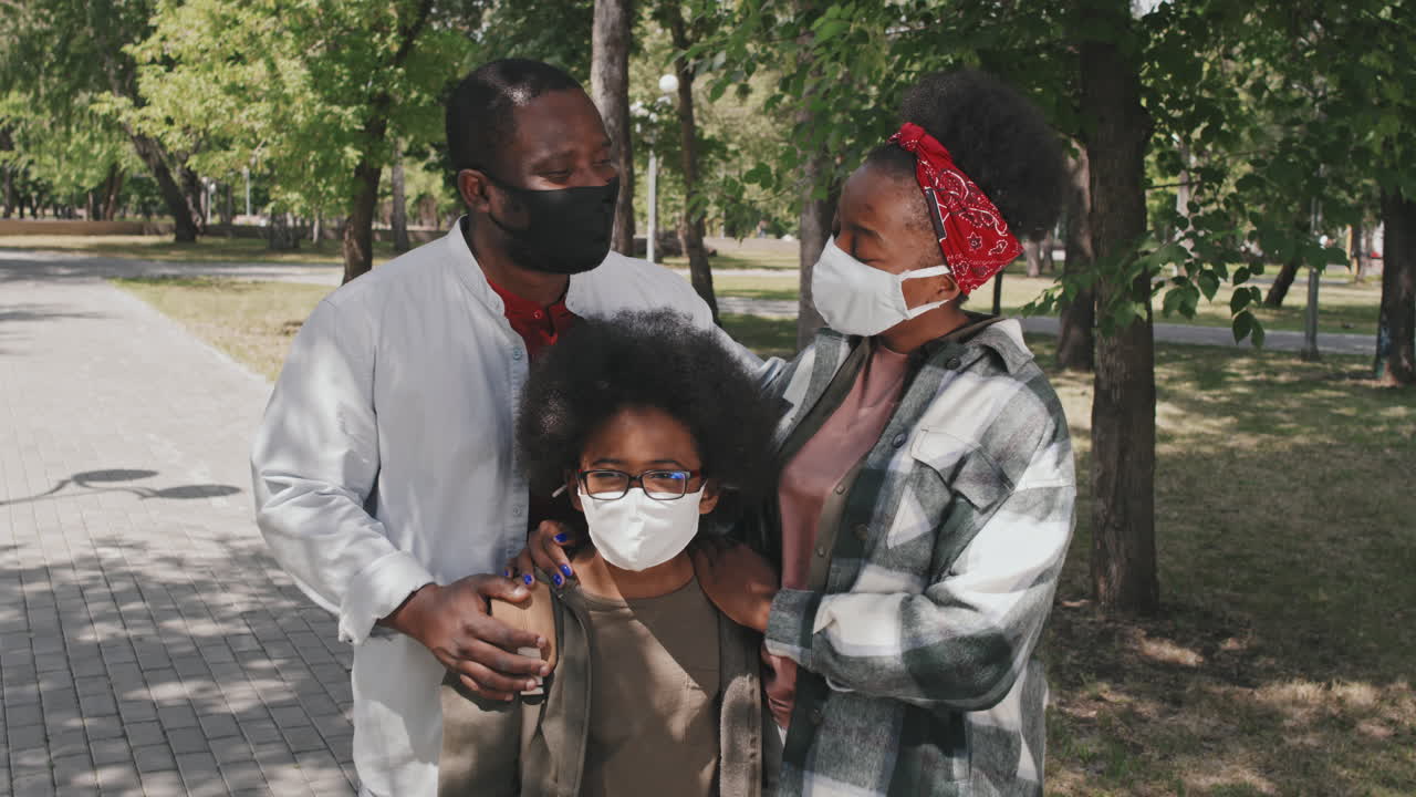 Portrait of African American Family in Face Masks Outdoors
