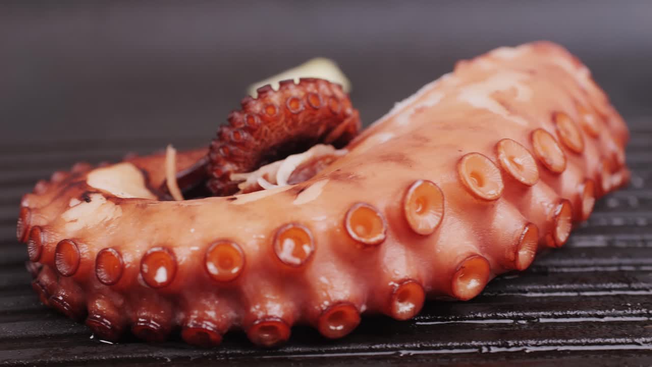 Octopus cooking, chef grill fresh octopus galician style on restaurant kitchen, healthy food, seafood cafe in spain, traditional asian japanese spanish and mediterranean dish.