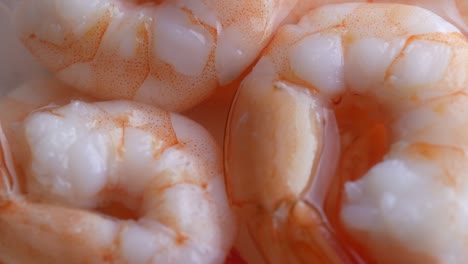 juicy delicious peeled shrimp in sauce, close-up rotate