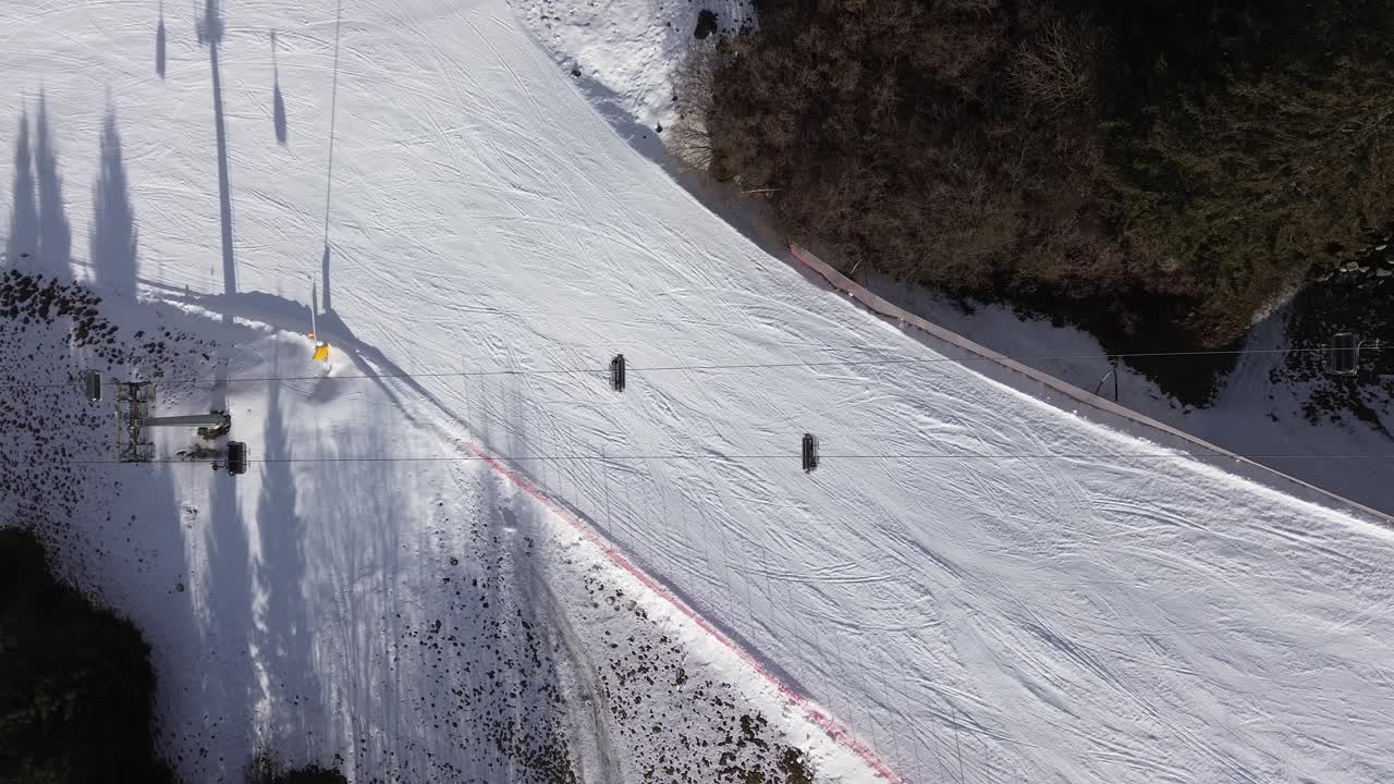 white snow There are winter sports that play the role of the Winter Olympics in Cortina and Milano Italy. Learning to ski and snowboard I capture these videos with my drone that is in a ski resort.