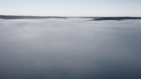 a drone flight over a sea of clouds, a feeling of lightness and freedom in this sunrise landscape.