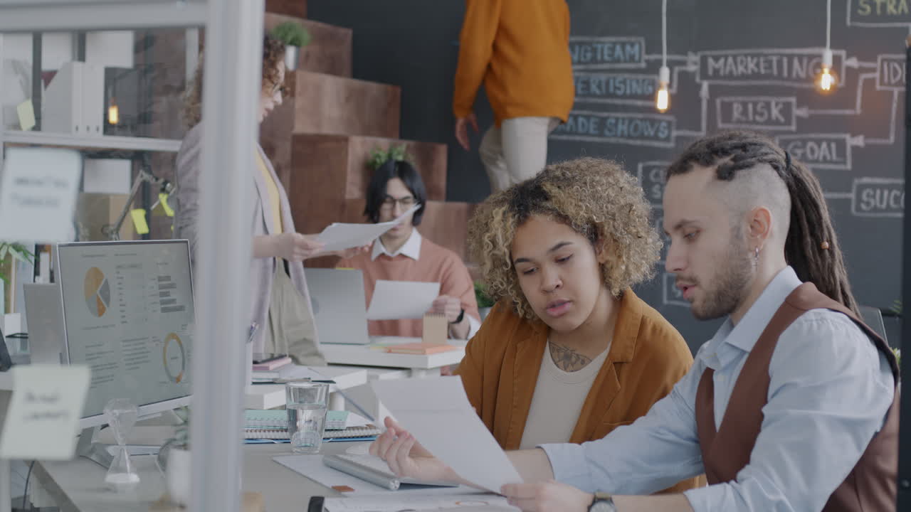 Business Team Reviewing Documents in Office