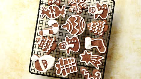 Fresh-baked-Christmas-shaped-gingerbread-cookies-placed-on-steel-grill