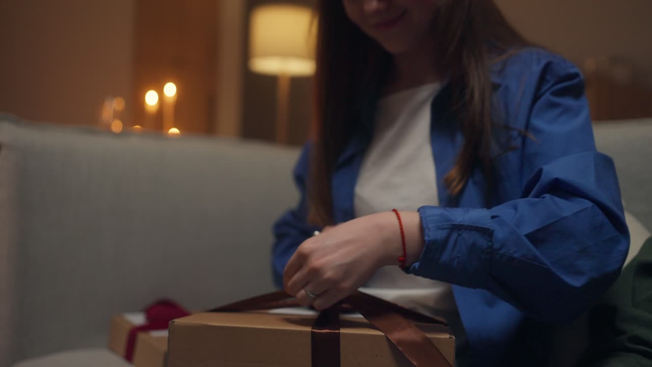 Woman opening a Christmas gift