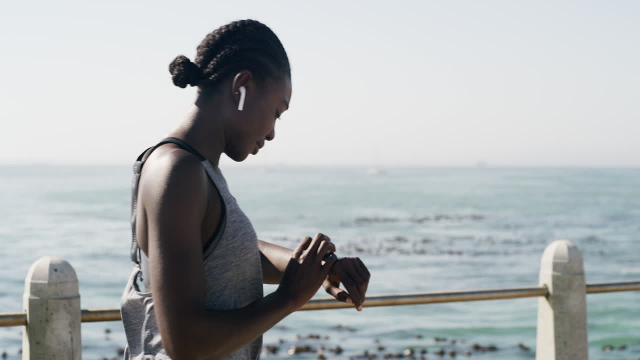 Woman Exercising by the Ocean