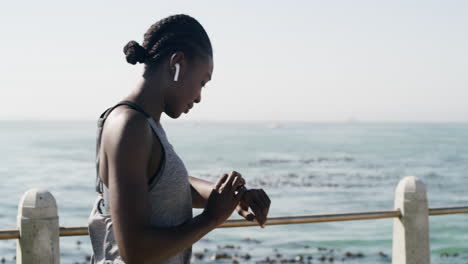 woman exercising by the ocean