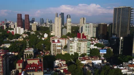 aerial view of the cityscape of polanco, sunny day in mexico city - circling, drone shot