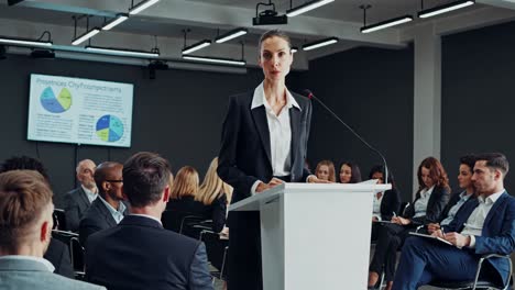 business woman giving a presentation at a conference