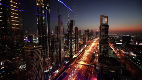 futuristic urban architecture infrastructure metropolitan cityscape skyline dubai sheik zayed road at night rush hour traffic city panorama dubai business