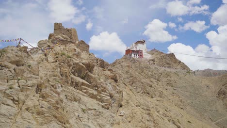 pan shot of namgyal tsemo buddhist monastery or gompa with upper himalayas landscape of leh ladakh india