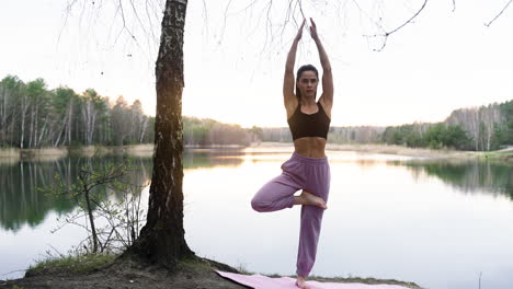 woman doing yoga in the forest