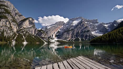 serene mountain lake with canoe